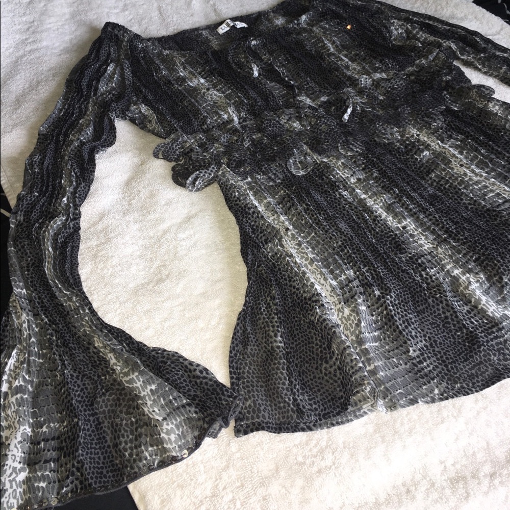Sheer blouse with embellishment.